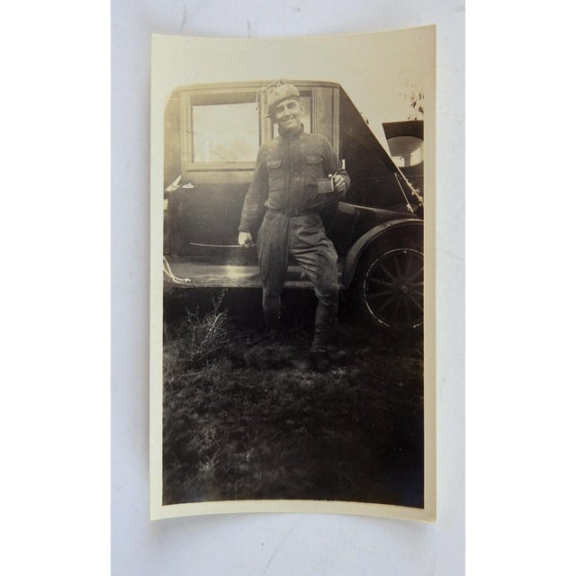 1920's snapshot photograph of a handsome guy outside his car enjoying his cup of coffee while on what looks like a very...