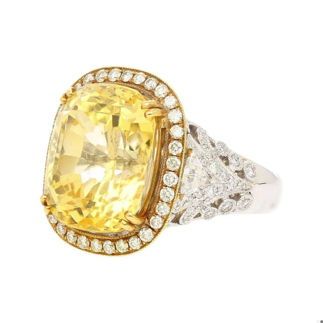Experience the epitome of vintage luxury jewelry, with this breathtaking 17-carat cushion cut no-heat yellow sapphire and...