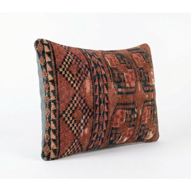 This beautiful 16'' x 24'' pillow cover was made from an authentic Turkish rug. Bright colors of wool adorn the front of...