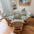 Straight out of the Golden Girls set. A well-maintained rattan dining table with glass top paired with four generous...