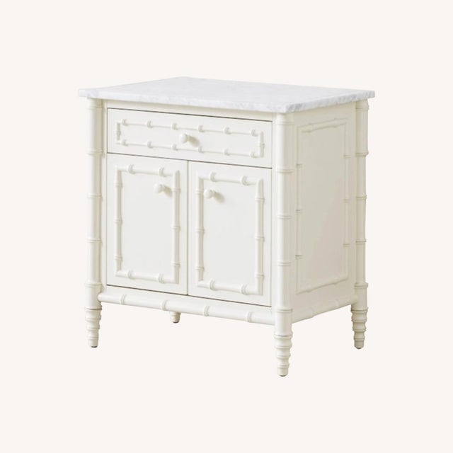 White-lacquered solid hardwood wood nightstands from Williams-Sonoma Home's discontinued Hampstead collection, hand-turned...