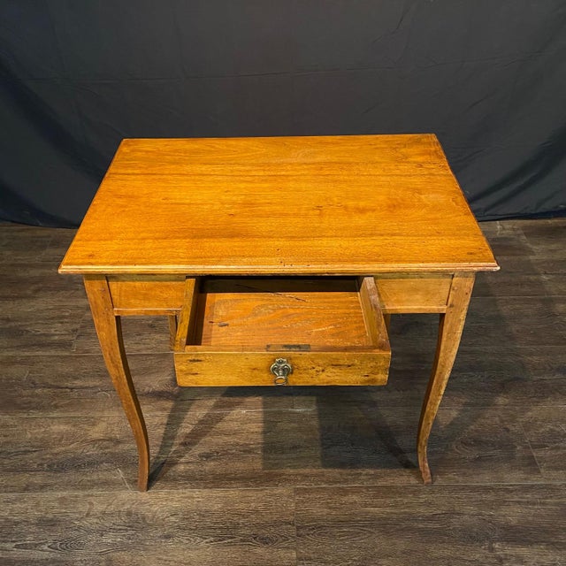 Elegant, simple, classic French fruitwood writing table, side table or desk, early 19th century, with a rectangular top...