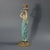 George Jones Majolica candlestick which features a lady dressed in a classical, flowing robe, holding the candle sconce...