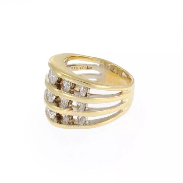 This gorgeous authentic ring is by Jose Hess, crafted from 18k yellow gold with a polished finish featuring 3 split front...