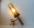 Brass and glass tubular wall sconce designed by Hans-Agne Jakobsson for Markaryd AB, Sweden. This piece has an attribution...