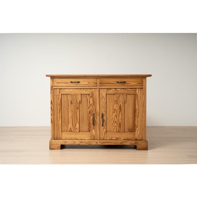 An antique Art Nouveau cabinet made of solid pine, originating from Germany and dating to circa 1910. The cabinet features...