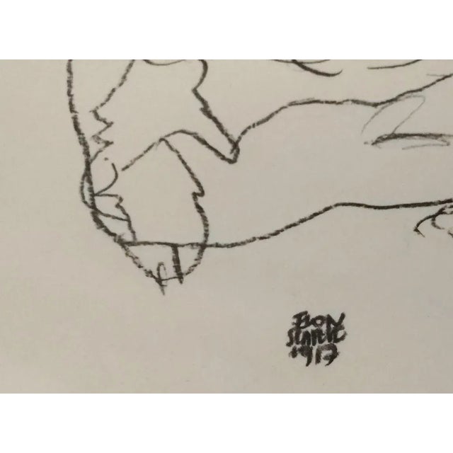 This lithograph from the portfolio ''Egon Schiele'' is a reproduction of ''Edith Schiele mit Hund Lord'', an original...