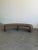 W83 D29 H20 SW80 Handcrafted and made in house. A curved bench in a nubby textured brown fabric. On the firmer side with a...