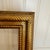 Bring classic charm to your art or photos with this vintage wooden frame, carefully refinished in a warm, antiqued gold....