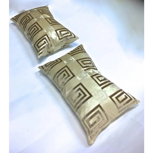 Pair of custom silk Greek key pillows. No maker’s marks. Down fill with zipper closures.
