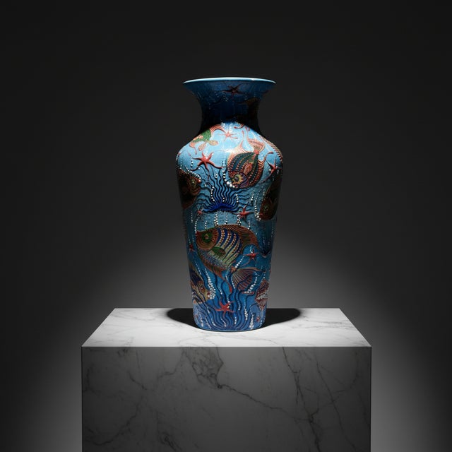 The Deep Blue Symphony This Handmade Ceramic Grand Column Vase is not just decor; it is an immersion into the deep....