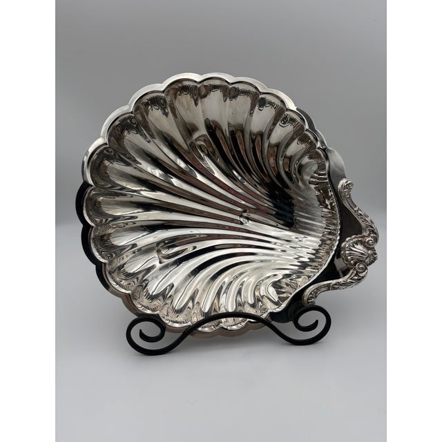 Large vintage silverplate scallop shell serving dish by English Silver Mfg. Corp., Brooklyn, New York, mid-20th century....