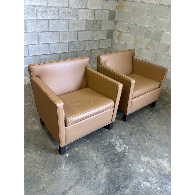 Wonderful pair of club chairs designed by Ludwig Mies van der Rohe for Knoll circa 2004. The original design of these was...