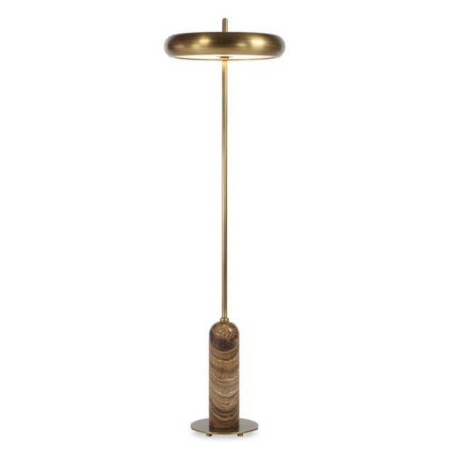 Exuding quiet mod-inspired luxury, this sculptural floor lamp pairs the natural beauty of richly veined tan/brown onyx...