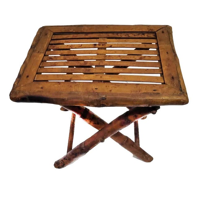 Bring a layer of organic texture and Hollywood Regency flair to your space with this mid-century modern folding accent...