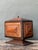 This exceptional vintage Tramp Art wood box on pedestal exemplifies the ingenuity and craftsmanship of the celebrated...