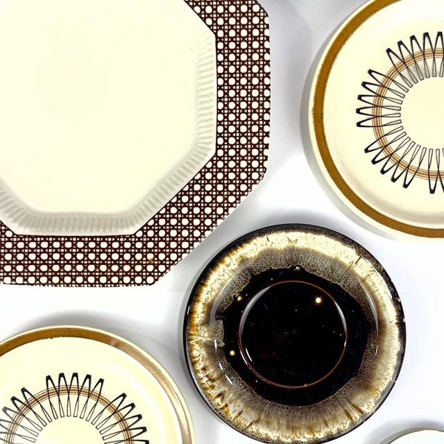 Elevate your space with this stunning, 13-piece vintage curated wall plate gallery set. Perfectly balancing retro warmth...