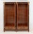 Empire Style Gilt Metal Mounted Mahogany Vitrine Cabinet, with two glass-paneled two-door compartments opening to glass...