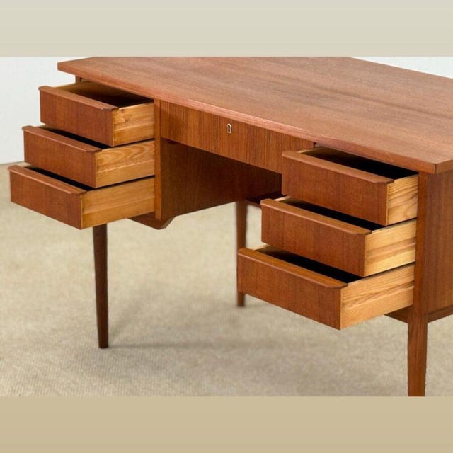 Handcrafted in Denmark during t he 1960s , this beautiful Mid-Century teak desk embodies the quiet elegance and refined...