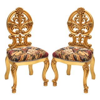 Set of 2 French Rococo-Inspired Accent Chairs – Gold Leaf Frames, Sculpted Floral Crests & Pastoral Tapestry Upholstery For Sale