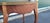 A fine pair of antique French satin wood end tables. Featuring beautiful figured satin wood tall slender bird like legs...