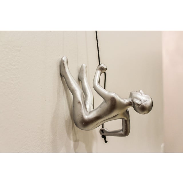 Our Sleek Silver Climbing Man is a beautiful addition to your wall decor! Curate your own collection with our variety of...