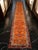 Hailing from the Oushak region of Aegean Anatolia, this remarkable 1960s hand-knotted runner offers an unprecedented scale...