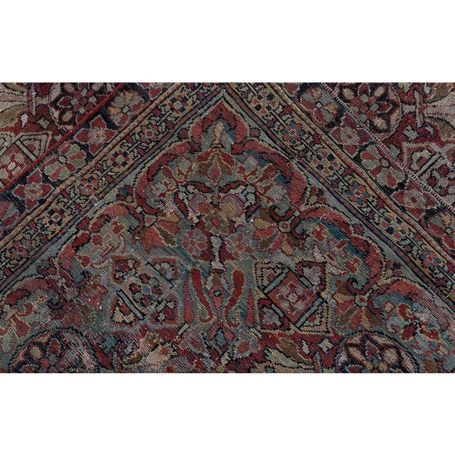 This exquisite antique Amritsar rug, woven in India circa 1910, embodies the grandeur and refinement for which Amritsar...