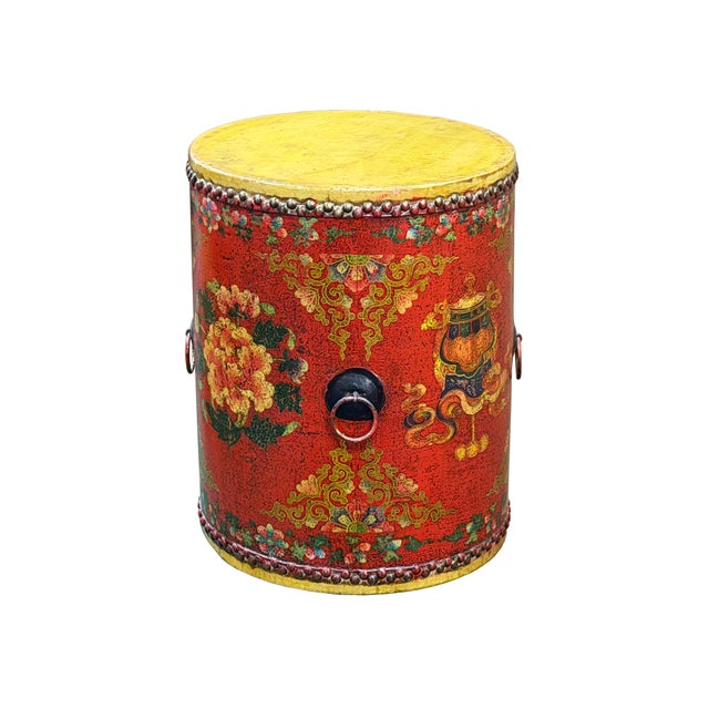 Infused with vibrant color and traditional craftsmanship, this striking round leather chest features a rich vermilion red...