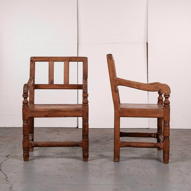 Set of six mid-century Spanish Revival vernacular ladder back pine chairs., two armchair and 4 side chairs. These chairs...