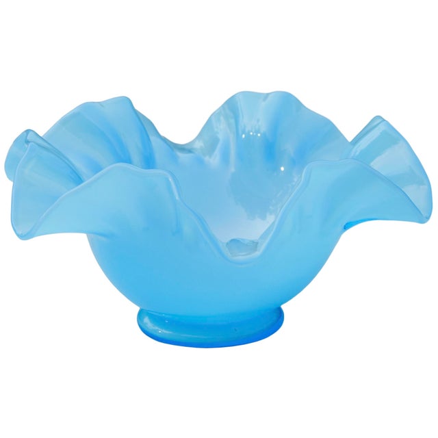 Eye-catching antique heavy glass centerpiece hand-blown in a striking shade of color blue, featuring an elegant and sleek...