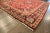 A beautiful Vintage Afshar hand-knotted Wool rug with a red field and multicolor accents in an all-over geometric floral...