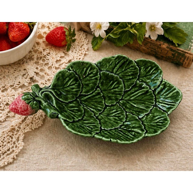 Vintage Portuguese ceramic dish by Olfaire, designed in a layered strawberry leaf motif with a sculptural fruit handle and...