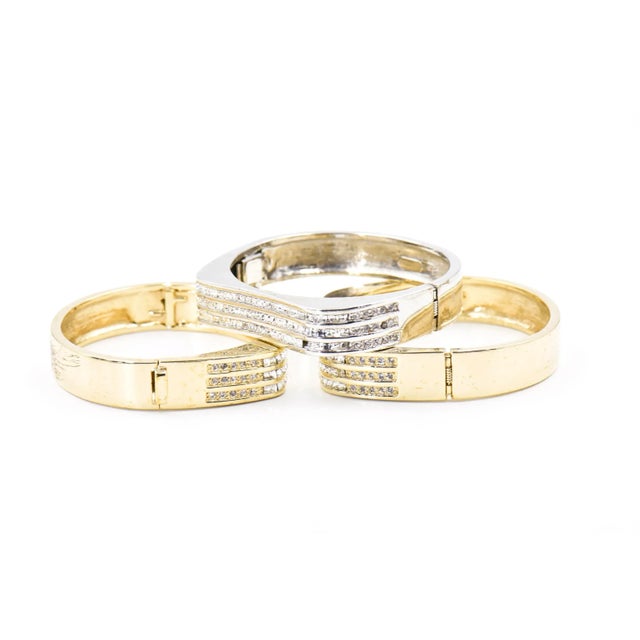 Beautifully made Italian bangle bracelets featuring three rows of crystals across the front of each bracelet. The front...