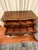 Rich wood tones, graceful curves, and intricate details give this vintage Henredon chest an elegant presence. Its...