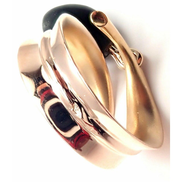 About This Piece: Metal: 18k Rose Gold Measurements: Weight: 7.7 grams Width: 9mm Stones: NONE 1 Olive shape wood. Size:...