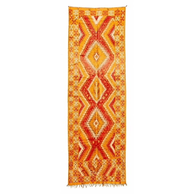 A striking vintage Moroccan Berber tribal runner, handwoven in Morocco circa 1960. This one-of-a-kind North African rug...