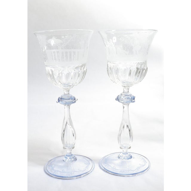 A fine pair of vintage Venetian glass wine stems or goblets. Attributed to Salviati. In clear glass with a light blue...