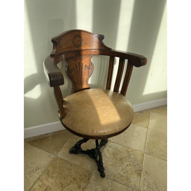 Cast iron and oak ship’s, captain’s, pilot’s chair