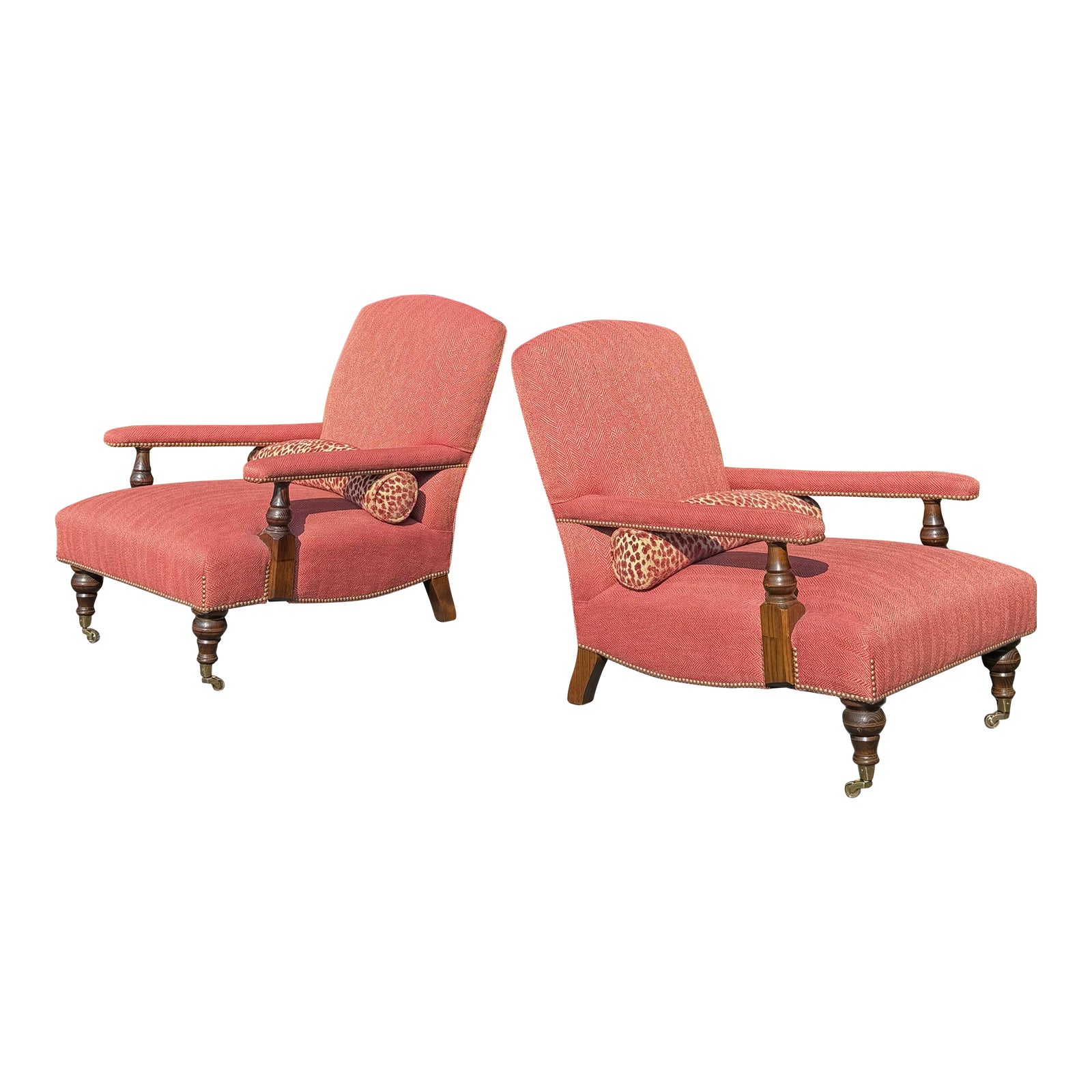 Pair of pink Edwardian style lounge chairs with carved wooden legs