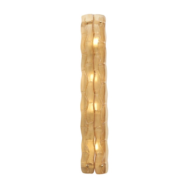 A striking pair of contemporary Italian Murano glass wall sconces, produced in 2025, distinguished by their warm amber-...