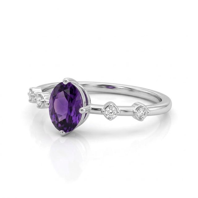 This elegant ring features a stunning Amethyst gemstone, admired for its rich violet-purple hue and captivating...