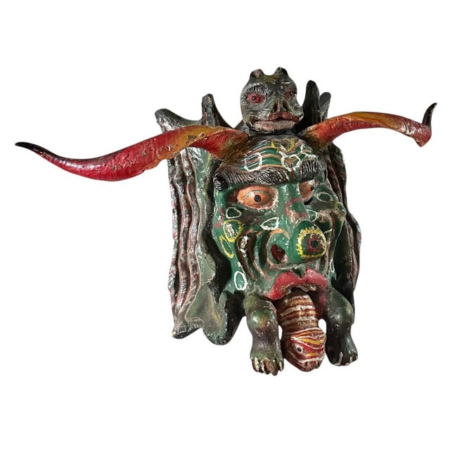 Captivating Mexican folk art horned mask dating from the early 1900s. Hand carved and hand painted with expressive detail,...