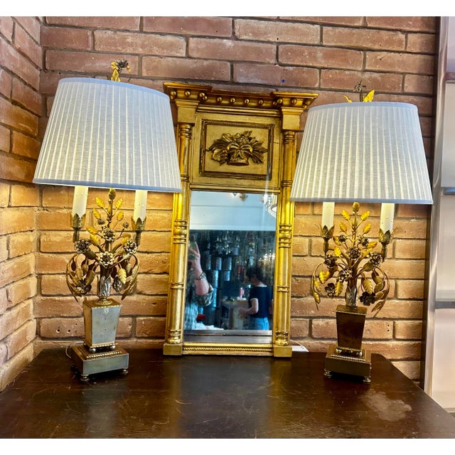 A spectacular and substantial pair of mid-century Hollywood Regency table lamps, featuring a dramatic botanical "bouquet"...