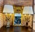 A spectacular and substantial pair of mid-century Hollywood Regency table lamps, featuring a dramatic botanical "bouquet"...