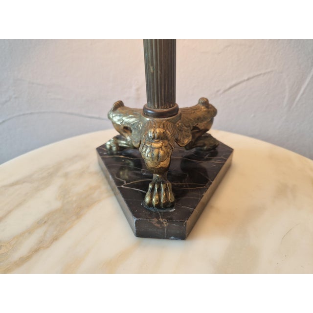 Elegant table lamp in Empire style. Brass frame with lion paws on marble top. European Plug (up to 250V).The wiring of...