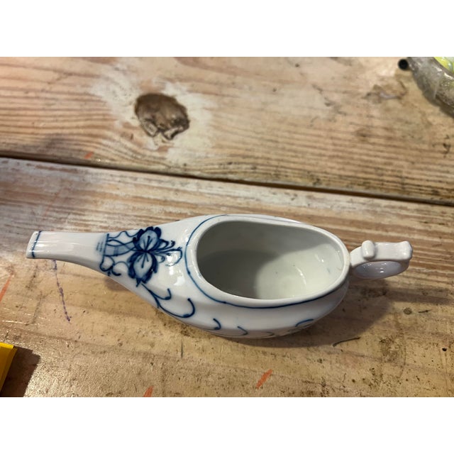 This beautiful delicate porcelin pitcher is an antique collectible. It could be used as a small creamer. But Through...