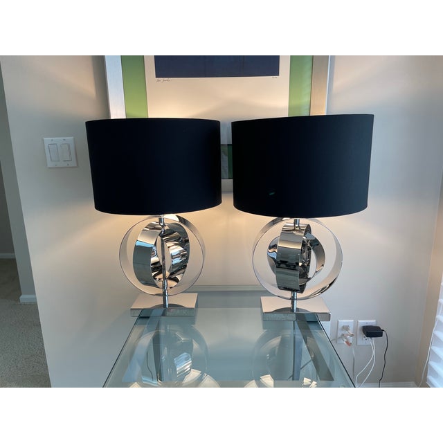 Stunning and flawless pair of identical, genuine, original chrome lamps by George Kovacs. Both lamps are in perfect...