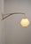 Danish wall lamp from the 1960s with a wooden arch in bamboo. The pearl shade lamp was designed by Lars Schiøler and...