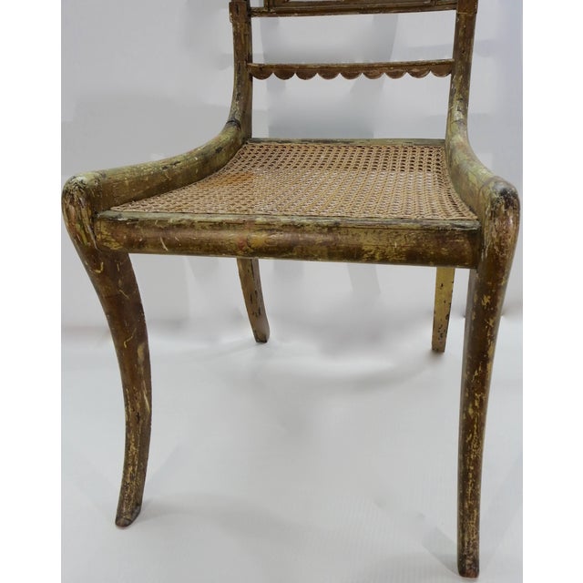 The woodwork on this side chair is outstanding. From the scalloped and swirled back to the cane bottom seat, it catches...